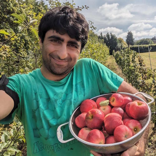 Karim with new apples from his seedling 73